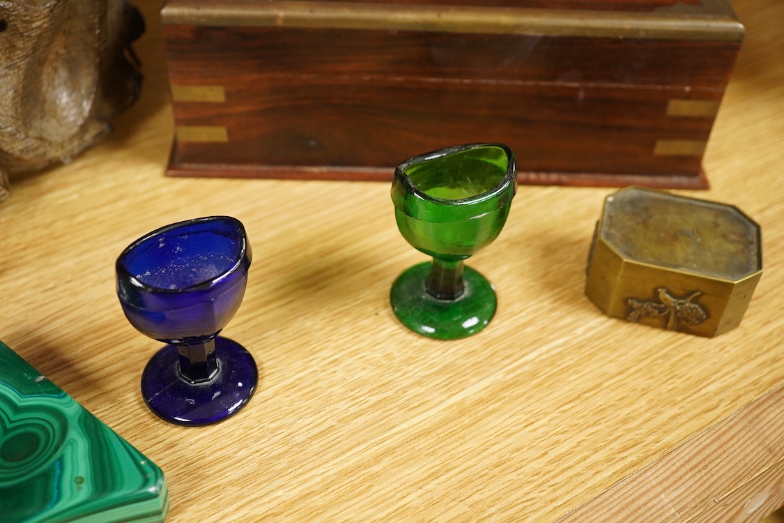 A carving of a Tudor rose-30cm wide, a brass bound box, small brass box, two eye baths, a green malachite ashtray etc